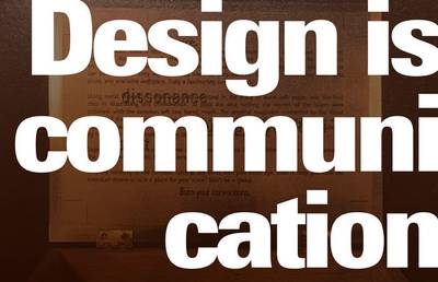 The title overlaid on the image with the text set large and tight, breaking text mid-word to fill the space