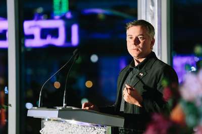 Coryndon standing at the podium