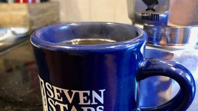 Close-up photo of a full coffee cup