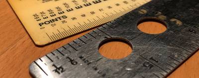 Close-up of two rulers
