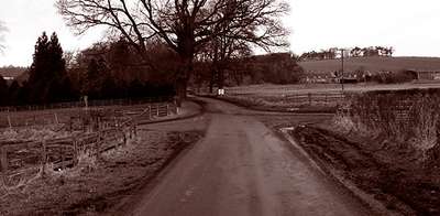 Photo of a dirt crossroads by James Denham