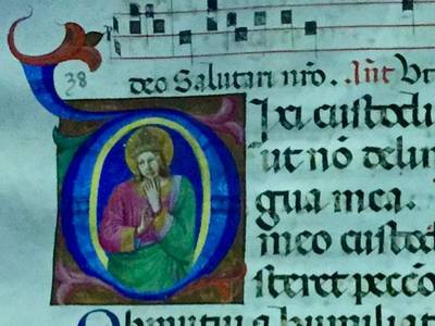 An illustrated manuscript with an elaborate dropcap