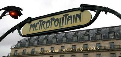 An image a classic Art Nouveau-style Metropolitain entry sign in Paris