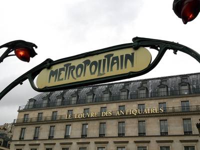 An image a classic Art Nouveau-style Metropolitain entry sign in Paris
