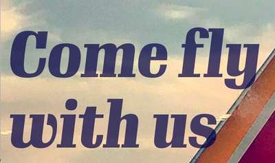 Text slightly overlapping the tail section of a Southwest Airlines jet